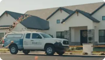 pest control truck in front of residential building